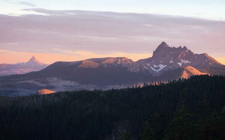 a mountain range at either sunrise or sunset